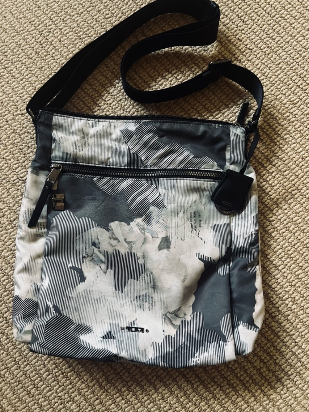 Tumi Voyager Crossbody Bag in grey floral watercolor.